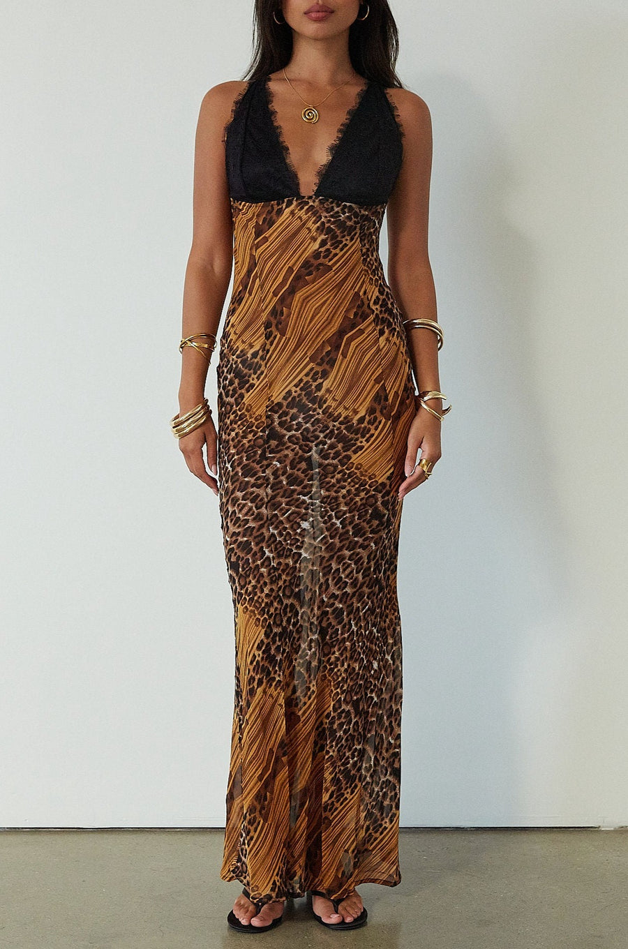 Printed chiffon maxi dress. Adjustable crisscross back straps. Lace cups. Unlined. leopard dress. leopard maxi dress. vacation dress. fancy dinner dress. 