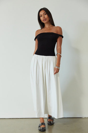 Colorblocked maxi dress. Knit bodice. Woven skirt. Twisted straps. Fully lined. white and black maxi dress. off the shoulder dress. twist strap