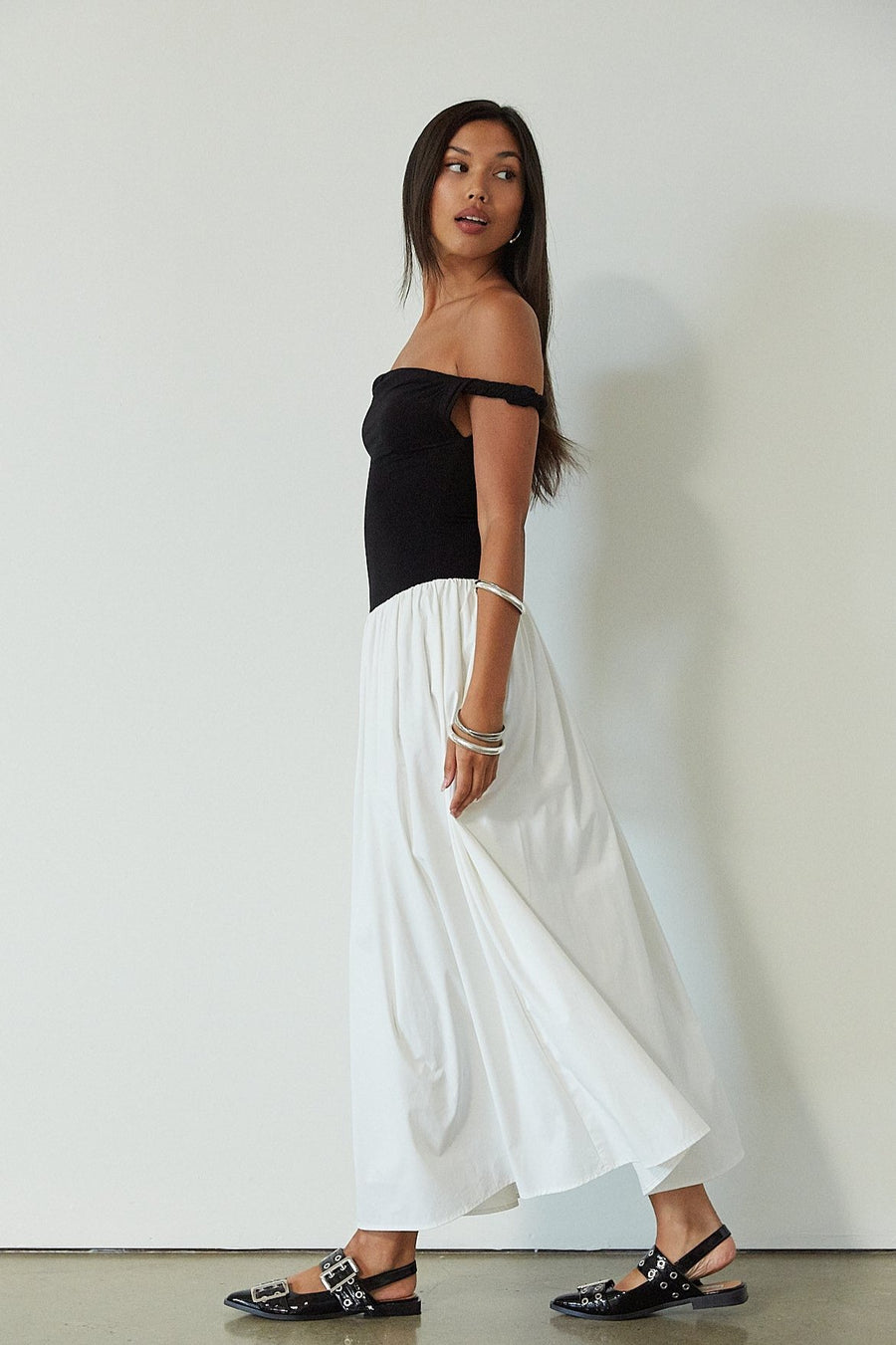 Colorblocked maxi dress. Knit bodice. Woven skirt. Twisted straps. Fully lined. white and black maxi dress. off the shoulder dress. twist strap