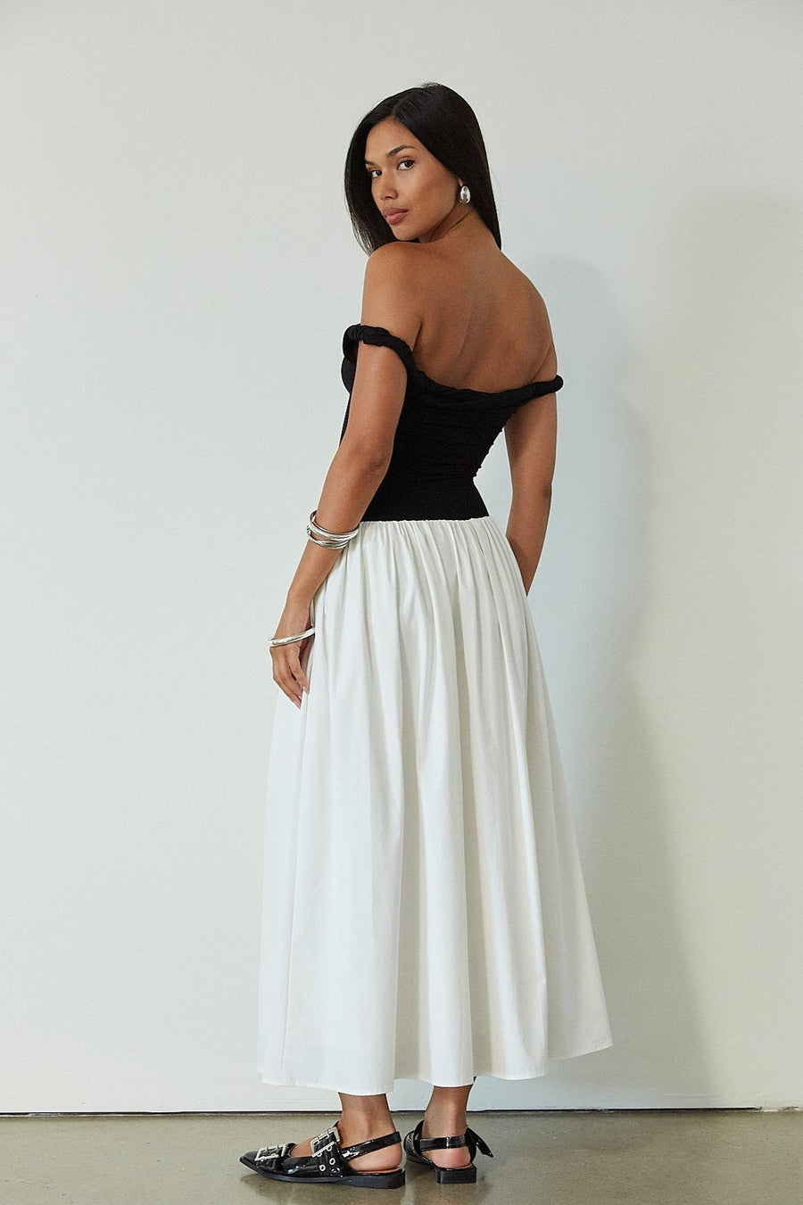 Colorblocked maxi dress. Knit bodice. Woven skirt. Twisted straps. Fully lined. white and black maxi dress. off the shoulder dress. twist strap