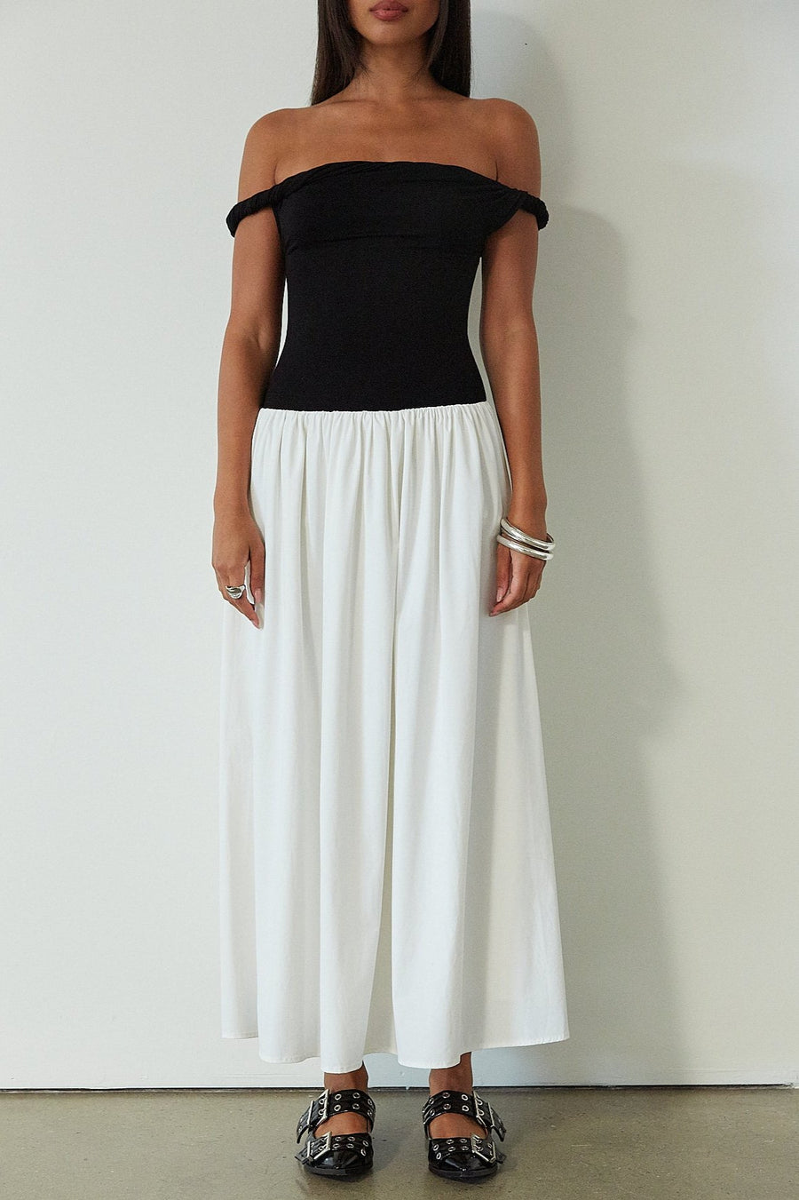 Colorblocked maxi dress. Knit bodice. Woven skirt. Twisted straps. Fully lined. white and black maxi dress. off the shoulder dress. twist strap
