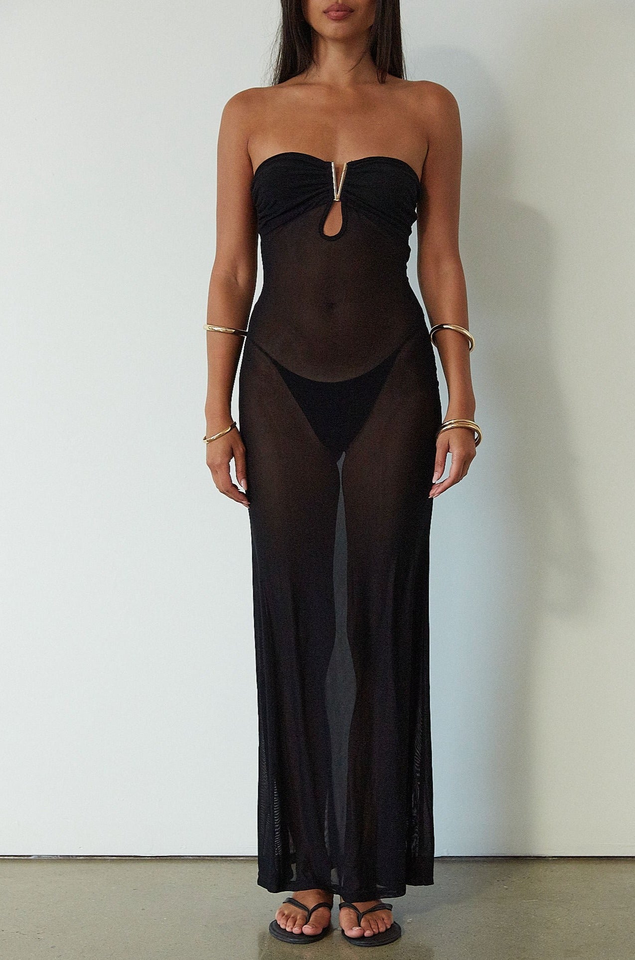 Knit mesh maxi dress. Strapless neckline. Front metal detail. Unlined. black maxi dress. black mesh maxi dress. mesh maxi dress. strapless maxi dress. mexico trip outfit. florida outift. evening dress. vacation dress. 