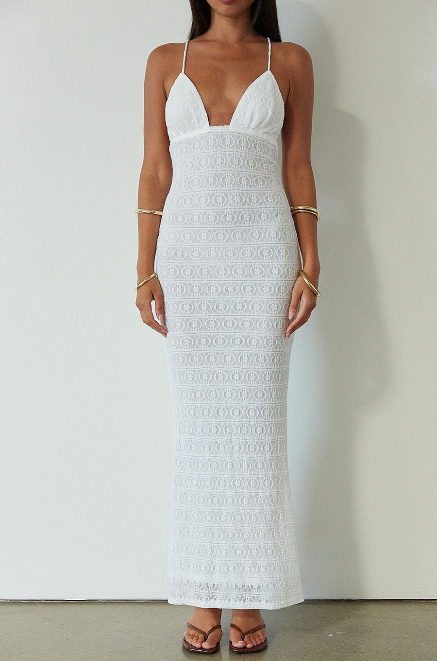 Knit lace maxi dress. Adjustable crisscross back straps. Back hook and eye and zipper closures. Fully lined. white maxi dress. engagement dress. bridal shower dress. beach wedding dress. vacation dress. beach vacation dress. 