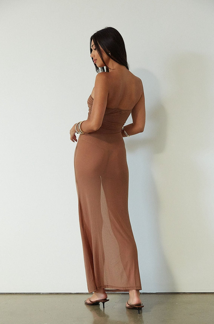Knit mesh maxi dress. Strapless neckline. Front metal detail. Unlined. brown maxi dress. brown mesh maxi dress. mesh maxi dress. strapless maxi dress. mexico trip outfit. florida outift. evening dress. vacation dress. 