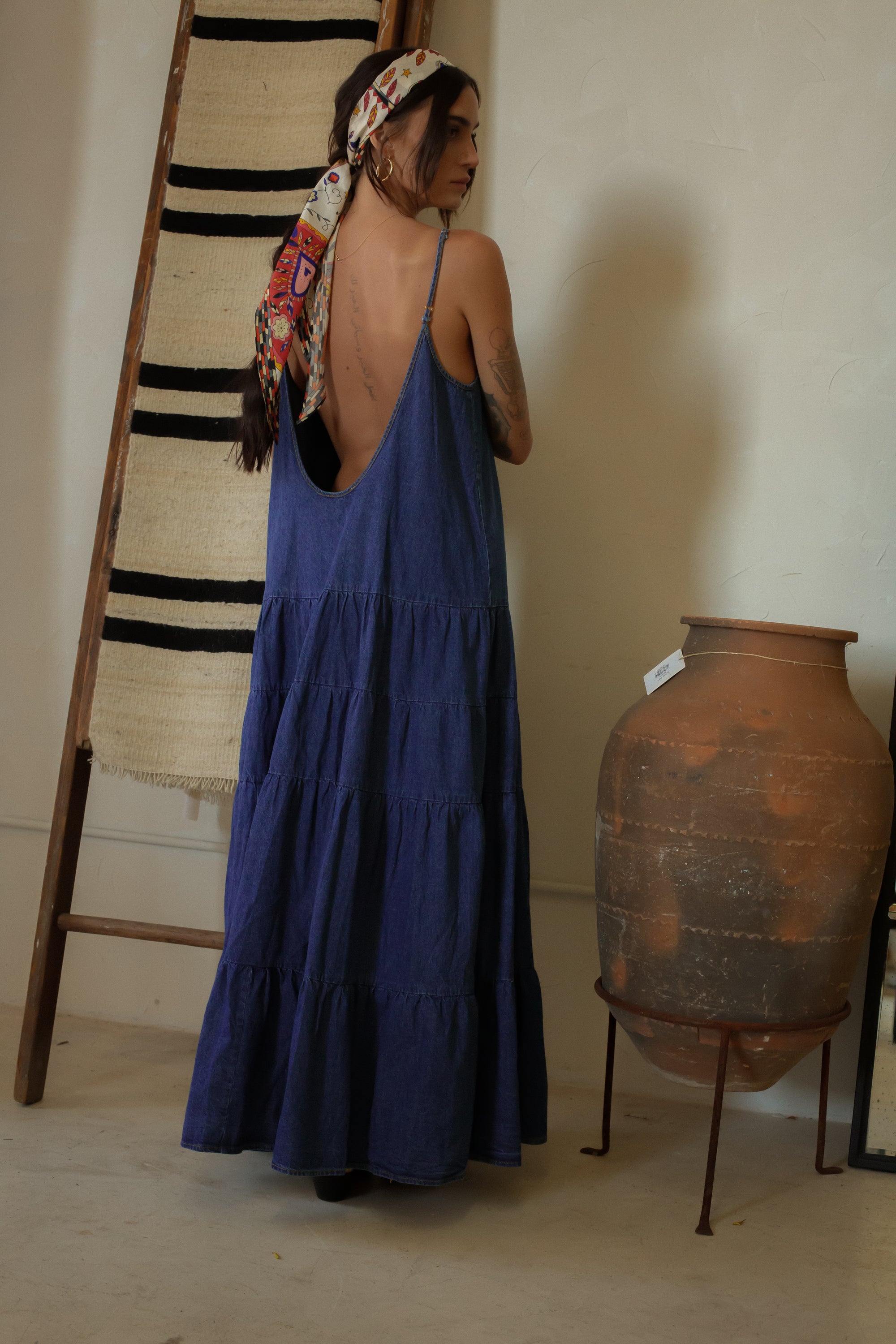 Tiered denim maxi dress. Adjustable straps. V-neckline. Front slit. Low back. Unlined. European summer aesthetic. Tuscany outfit inso. Tuscany aesthetic. Summer dress. denim maxi dress. summer outfit. everyday dress. vacation dress. outfit to wear to tuscany. day dress. 