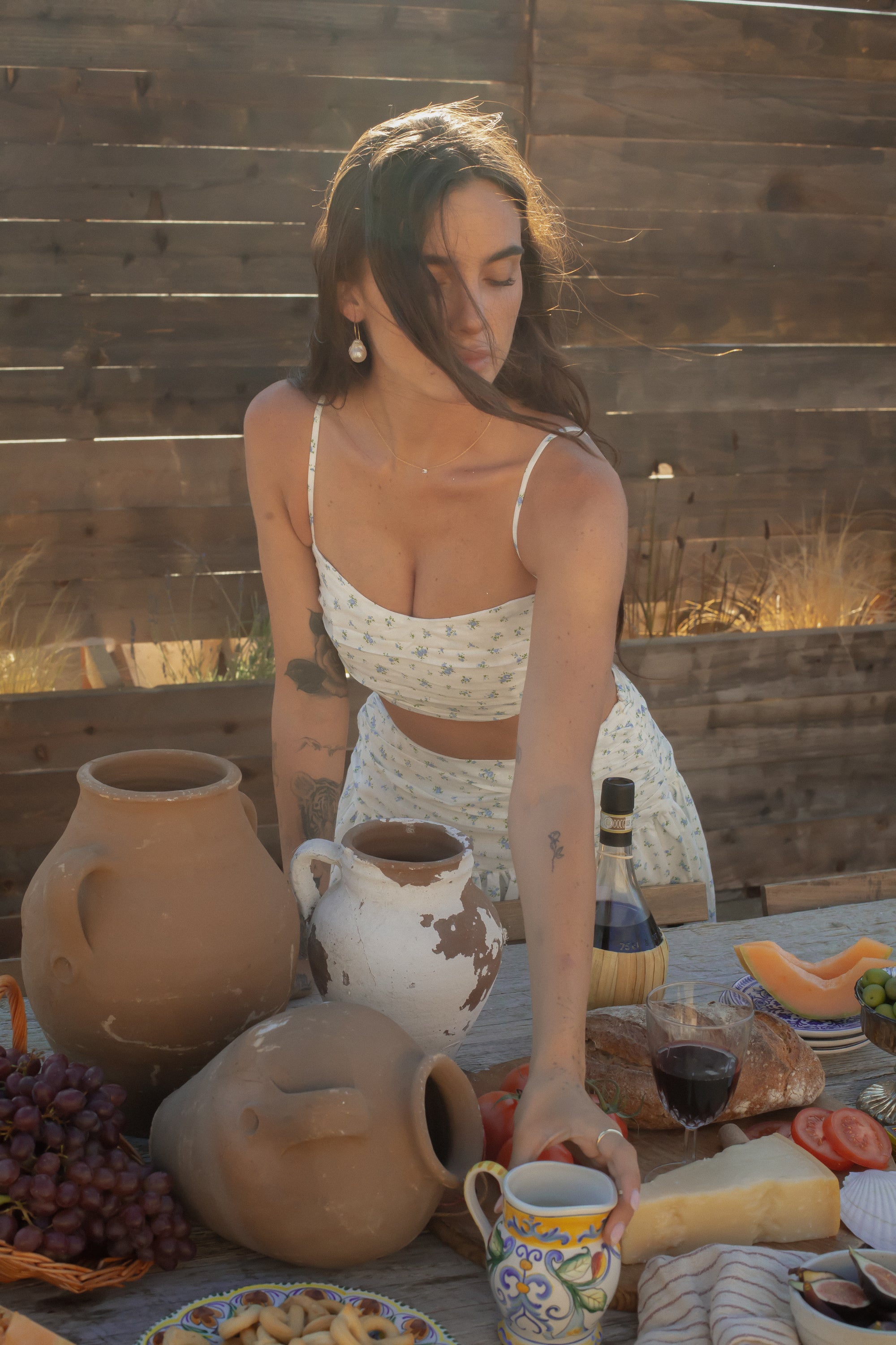 Floral printed ruched woven crop top. Adjustable straps. Side zipper closure. Elastic smocked back. Fully lined. European summer aesthetic. Tuscany outfit inso. Tuscany aesthetic. Summer top. floral cropped tank top. summer outfit. vacation top. outfit to wear to tuscany. skirt and tank top set. day outfit. wine tasting outfit. bridal shower outfit. engagement party dress.