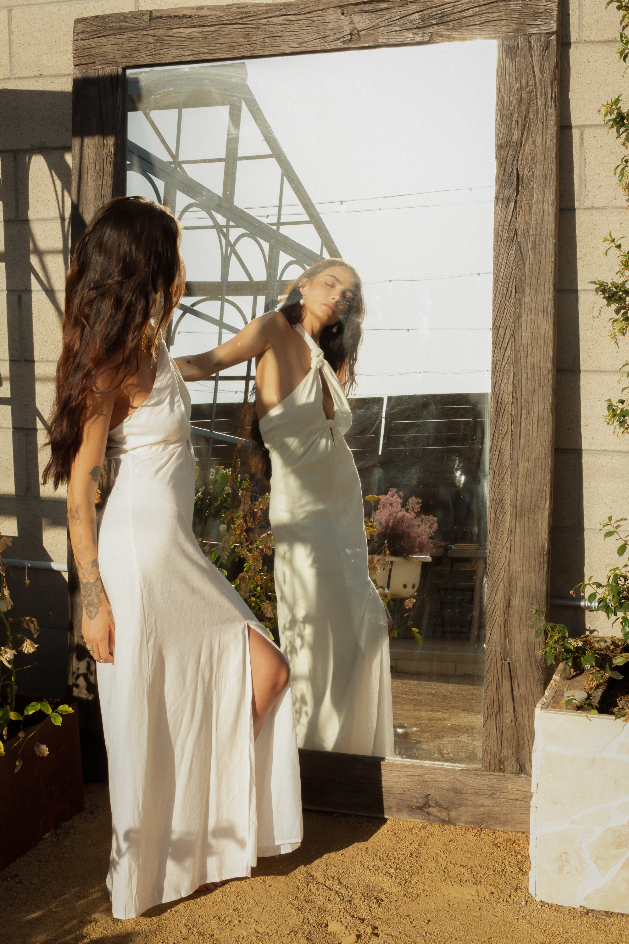 Woven maxi dress. Adjustable halter neckline with tie closure. Front slit. Back hook and eye and zipper closures. Fully lined. European summer. European summer dress. European summer aesthetic. Tuscany outfit inso. Tuscany aesthetic. Summer dress. white dress. white maxi dress. summer outfit. everyday dress. vacation dress. outfit to wear to tuscany. nice dinner dress. dinner dress. fancy dinner dress. white halter maxi dress. bride dress. engagement dress. engagement party dress