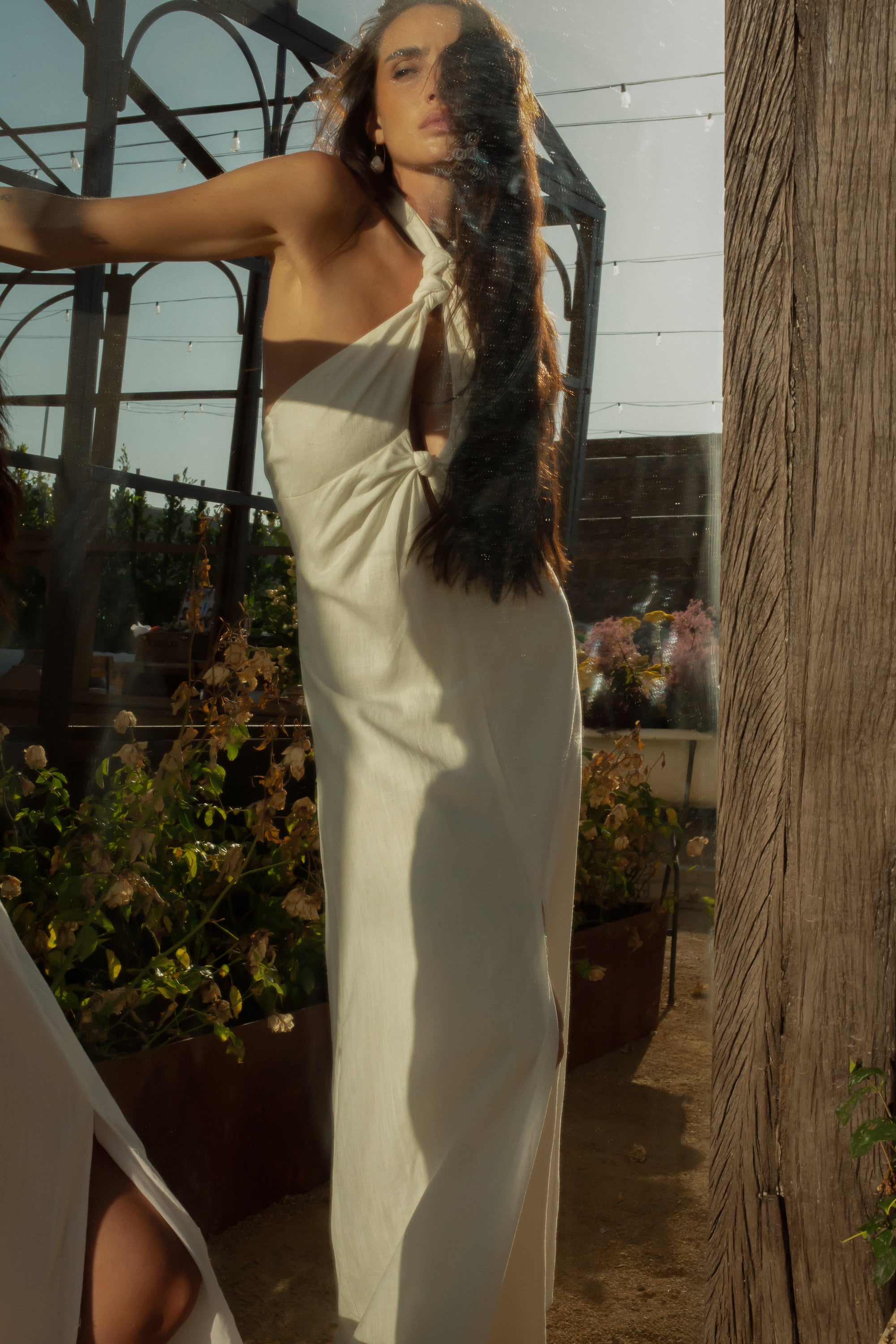 Woven maxi dress. Adjustable halter neckline with tie closure. Front slit. Back hook and eye and zipper closures. Fully lined. European summer. European summer dress. European summer aesthetic. Tuscany outfit inso. Tuscany aesthetic. Summer dress. white dress. white maxi dress. summer outfit. everyday dress. vacation dress. outfit to wear to tuscany. nice dinner dress. dinner dress. fancy dinner dress. white halter maxi dress. bride dress. engagement dress. engagement party dress