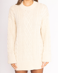 Cable knit sweater dress. Crewneck. Long cuffed sleeves. Unlined. beige sweater dress. fall sweater dress. holiday look