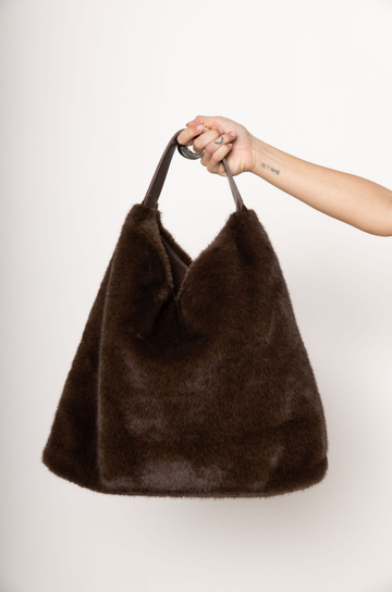 brown Faux fur tote
One inner zip pocket
Two inner slip pockets
Button closure
Imported
Polyester
brown fur bag
fall bag
fall accessories
