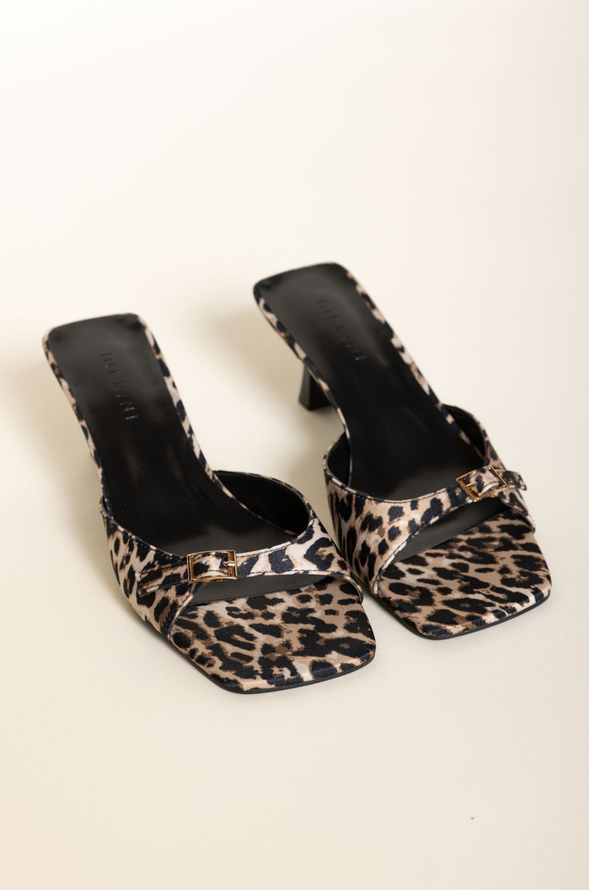 Leopard low stiletto mule heel
Open square toe
Wide, tapered toe strap
Buckle detailing on toe
Slip on design
Open heel counter
Synthetic