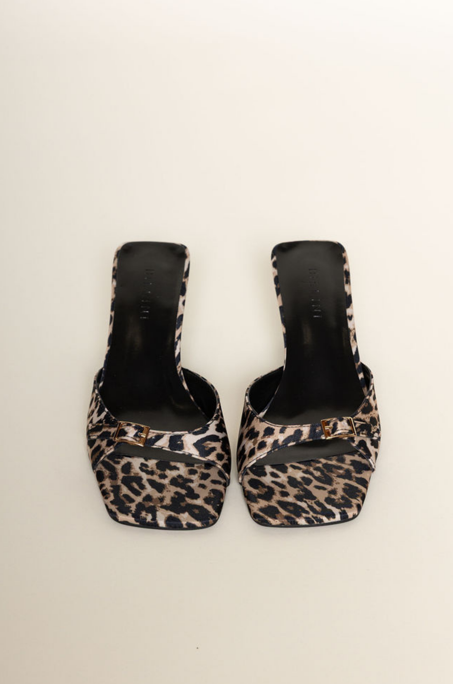 Leopard low stiletto mule heel
Open square toe
Wide, tapered toe strap
Buckle detailing on toe
Slip on design
Open heel counter
Synthetic