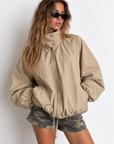 beige Oversized jacket features a slouchy silhouette, a lightweight cotton-blend fabrication, and a timeless funnel-neck collar for added dimension
Raglan sleeves
Front zipper closure
Side slit pockets