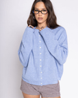 Fuzzy knit cardigan
Crewneck
Front button down closures
Long sleeves
Unlined
blue cardigan