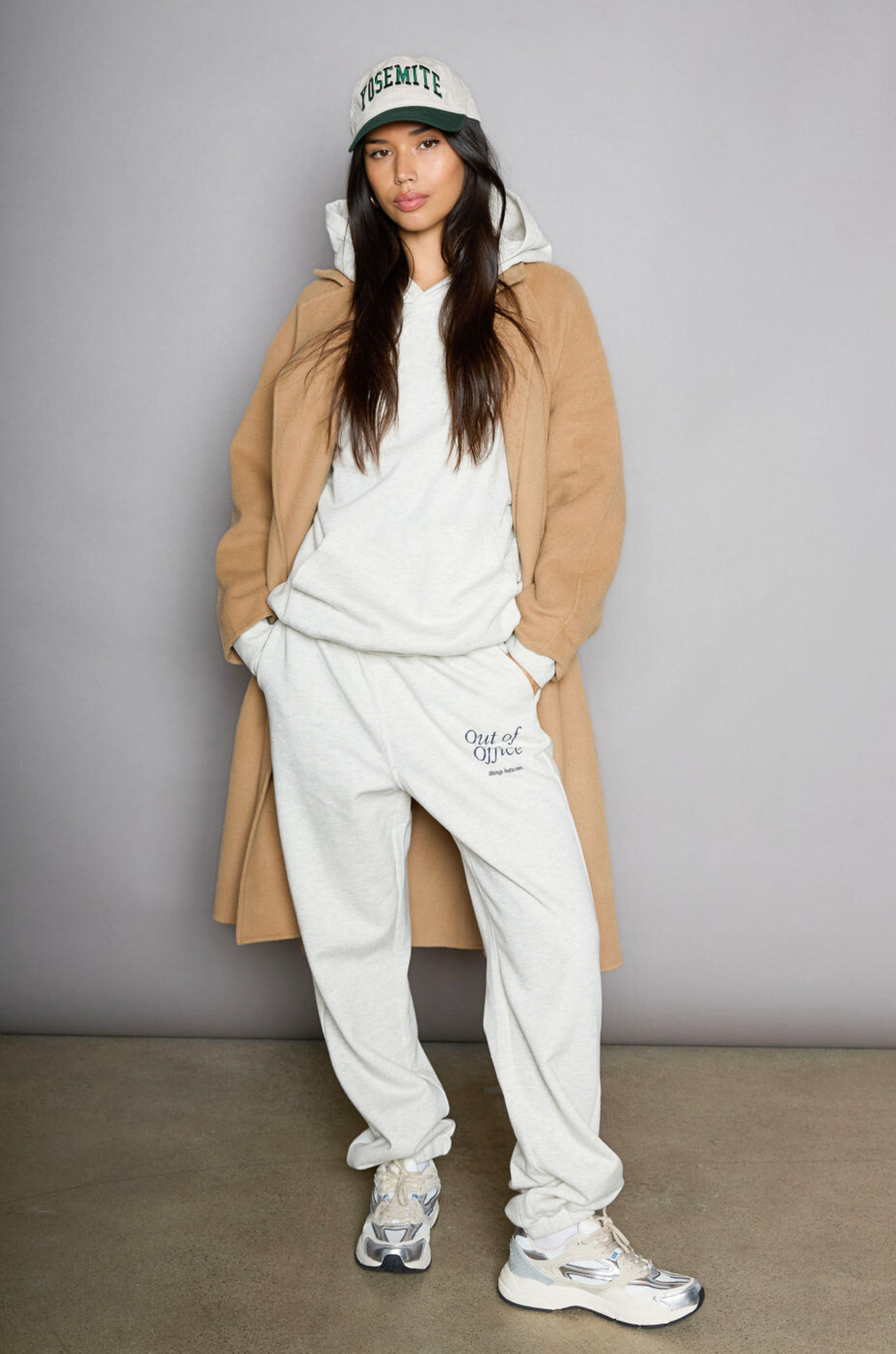 Graphic printed knit sweatset. Elastic waistband and leg openings. Side pockets. Fleece lining. hooded sweater. sweatpant. grey sweatset. out of office sweat set