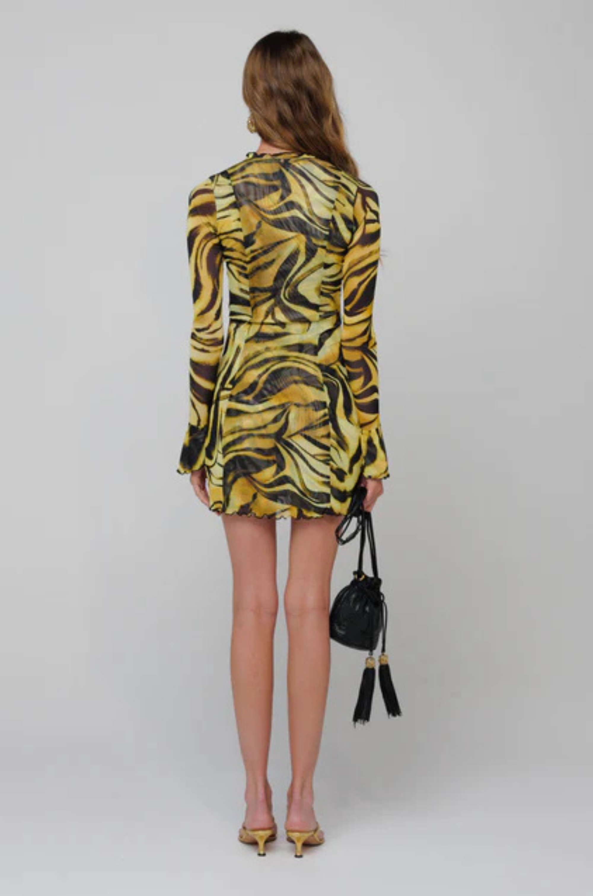 yellow and black Animal printed long sleeve mini dress
Ruffled trim neckline
Tie front detail
Deep v neckline tie keyhole
Lined