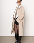 beige Longline trench coat
Pointed collar
Raglan sleeves
Welt pockets
Back slit
Midi-length
Button down closure