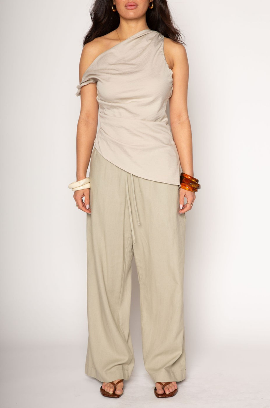 Woven wide leg pants. Elastic waist with drawstring closure. Side pockets. Back pocket. Unlined. resort wear. lounge wear. resort vacation pants. flowy pants. linen pants
