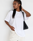 The fabric feels luxuriously soft and smooth against the skin, offering a breathable, lightweight comfort
Relaxed crew neckline
Cuffed sleeves
Length: 29.5"
50% cotton/50% modal butter jersey knit
white oversized basic tshirt top