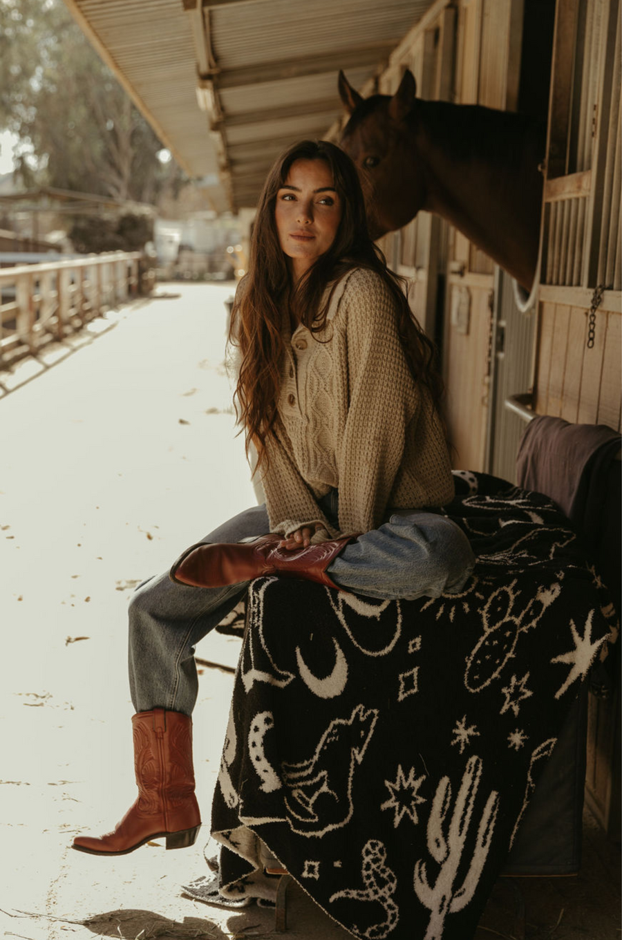 Fuzzy mixed knit crochet sweater. Collar neckline. Front button closures. Long sleeves. Banded hems. Unlined. tan sweater. knit sweater. quarter button up sweater