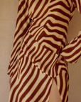 Animal printed long sleeve maxi dress
Front high slit 
Boat neckline
Adjustable back straps 
Open back Back zipper closure 
Lined, non-stretch 
zebra printed maxi dress 
long sleeve maxi dress