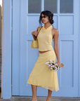 yellow Gingham halter top
Halter with cowl
Neck button closure
Open back
Adjustable back string
Lined/Sheer
spring outfit