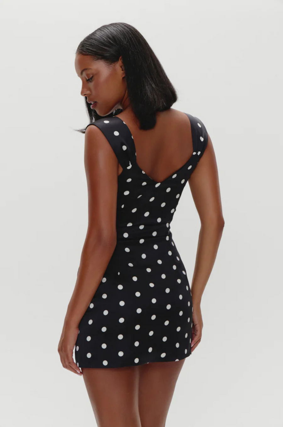 black and white Polka dot mini dress
Medium-weight dress fabrication with subtle shine
Sweetheart neckline
Princess seams on front and back for shaping
Side seam zipper