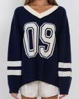 navy 09' graphic sweater jersey top
V neckline
Unlined
campus jersey sweater