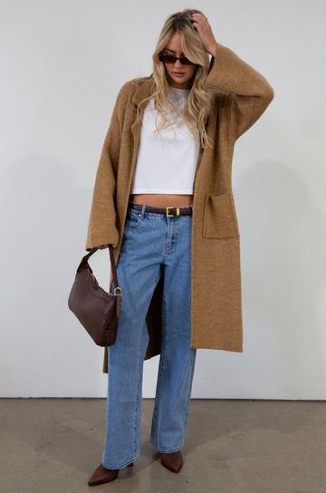 Fuzzy heather knit longline cardigan. Collar neckline. Long sleeves. Front pockets. Open front. Unlined. fall cardigan. tan long cardigan