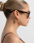 Oversized aviator frame
Featuring a straight brow line
Teardrop-shaped lenses
Distinctive keyhole bridge
Thick, structured frame with sculptural finish
tortoise frame and green lens aviator sunglsses