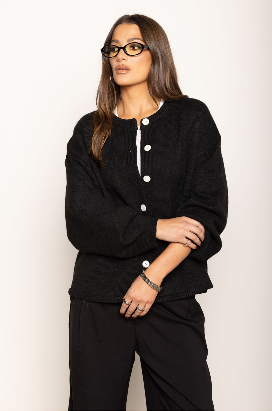 Heavy knit cardigan
Button down closure
Large buttons
Ribbed crew neckline
Ribbed hemline
Unlined
thick black oversized knit cardigan
fall outfit
thanksgiving outfit