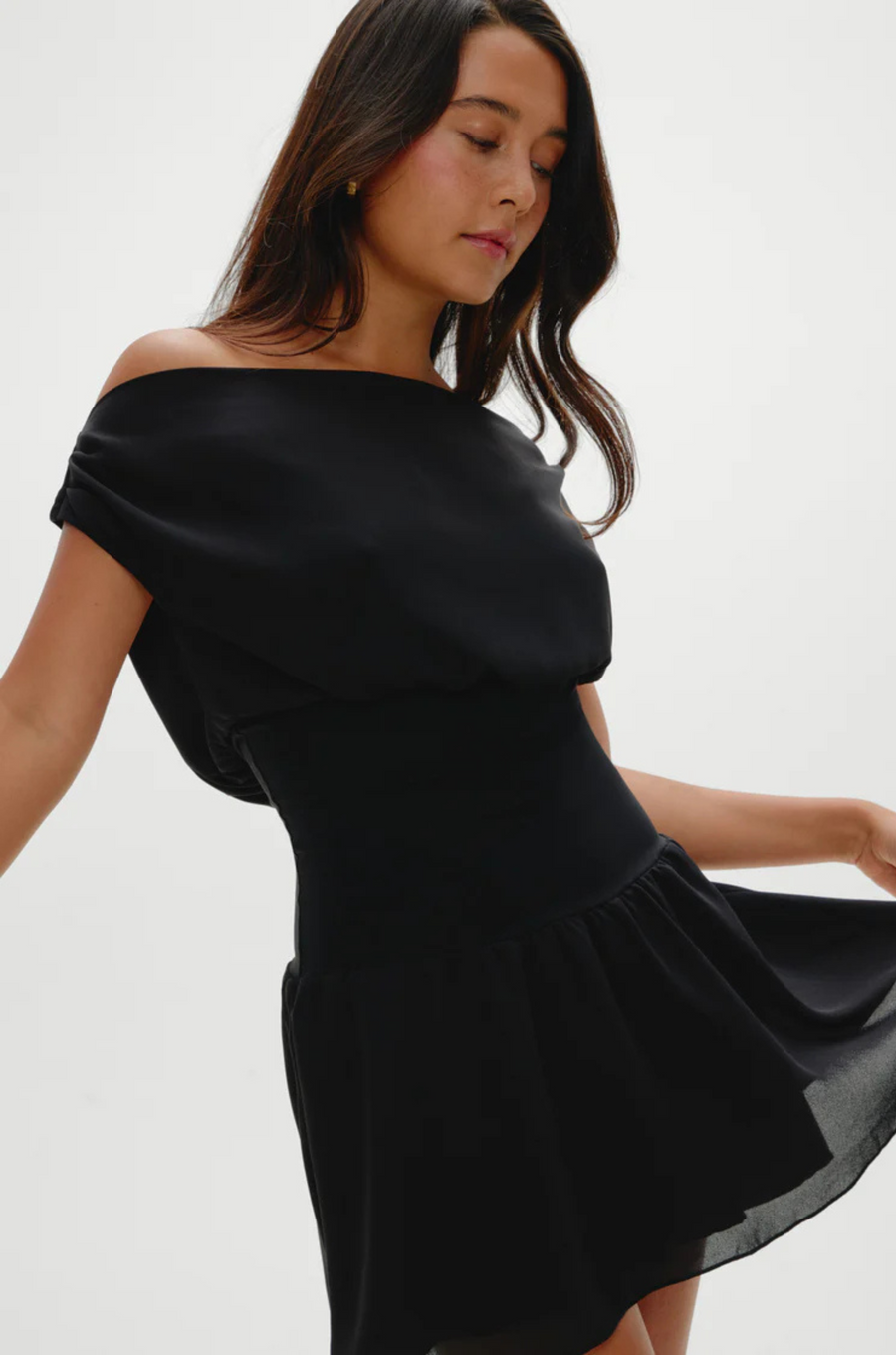 Stretchy knit midsection
Contrasted by lightweight chiffon through the neckline, bodice, and skirt
Wide neckline
Sits naturally as a boat neck and can be styled on or off the shoulders
Double layer skirt
Polyester
black mini dress