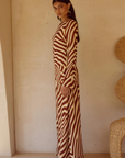 Animal printed long sleeve maxi dress
Front high slit 
Boat neckline
Adjustable back straps 
Open back Back zipper closure 
Lined, non-stretch 
zebra printed maxi dress 
long sleeve maxi dress