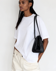 The fabric feels luxuriously soft and smooth against the skin, offering a breathable, lightweight comfort
Relaxed crew neckline
Cuffed sleeves
Length: 29.5"
50% cotton/50% modal butter jersey knit
white oversized basic tshirt top