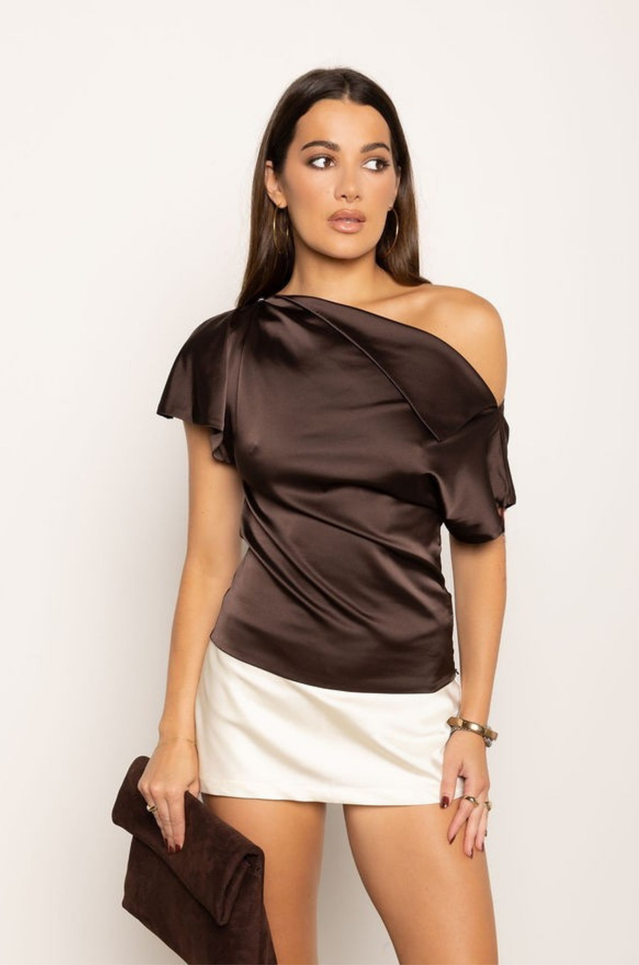 Satin asymmetrical off the shoulder top
Shoulder button closure
Front drape detail
Relaxed fit
Can be worn multiple ways
Side zipper closure
brown satin top
thanksgiving top outfit