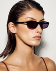 black Sleek, 90s-inspired essential sunglasses. Defined by their slimline rectangle silhouette, this modern style is elevated with gold metal tips on the arms for a refined, polished finish.

Featuring:
slimline rectangle silhouette
90s inspired design aesthetic
gold metal tip detailing on arms
lightweight frame construction
includes branded case and cleaning cloth
designed in Australia
UV protection | UV400