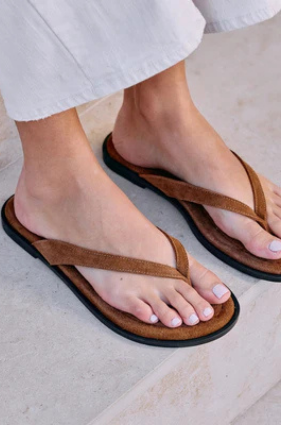 brown Suede flip-flop sandal
Suede upper
Manmade outsole
Suede lining
Padded insole
Slip-on style
Runs small - sizing up 1 whole size is recommended