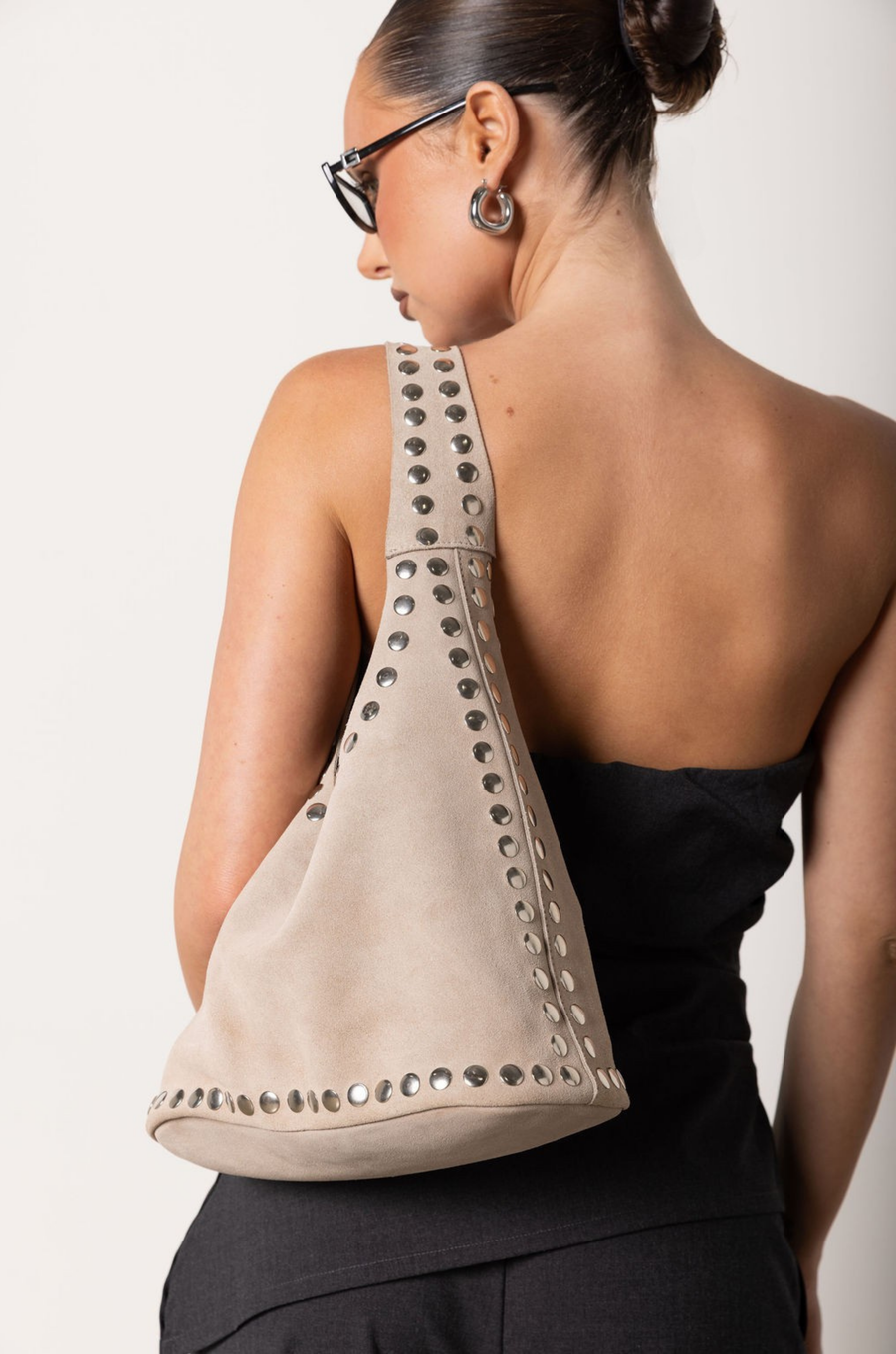 Beige suede tote bag with studded details