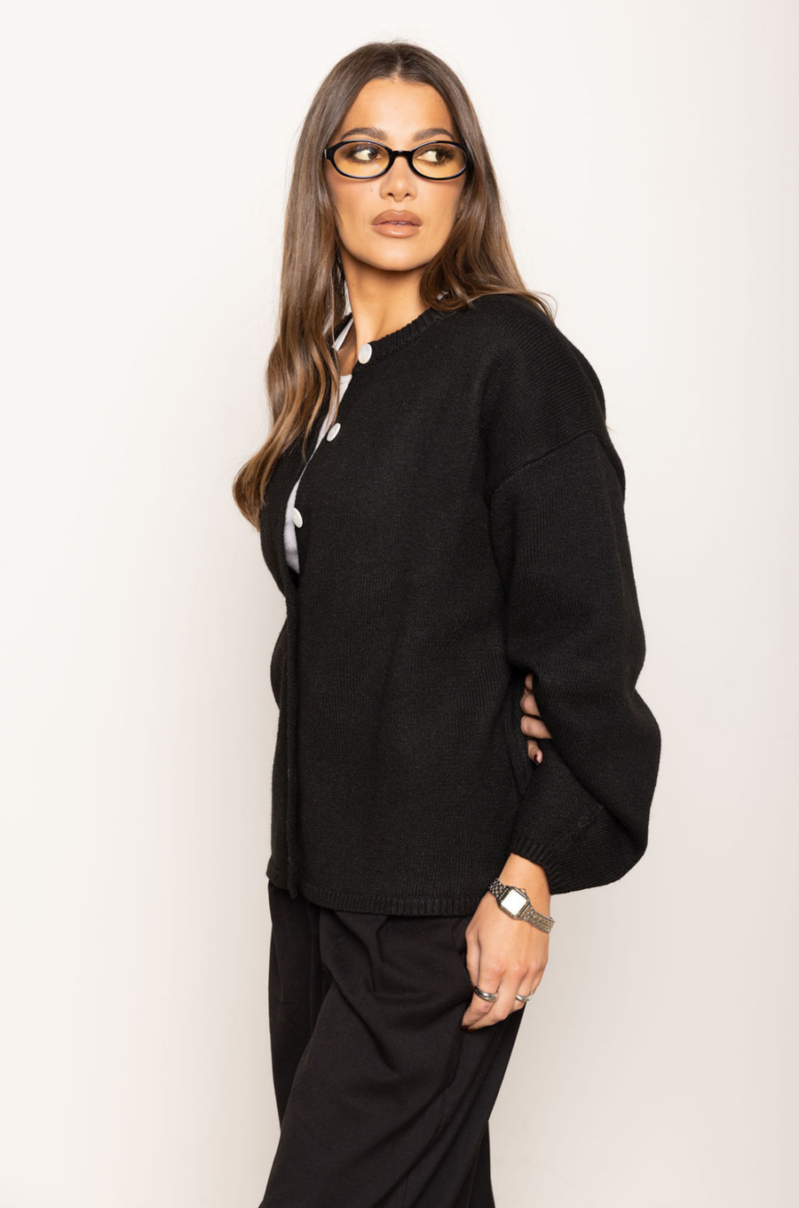 Heavy knit cardigan
Button down closure
Large buttons
Ribbed crew neckline
Ribbed hemline
Unlined
thick black oversized knit cardigan
fall outfit
thanksgiving outfit