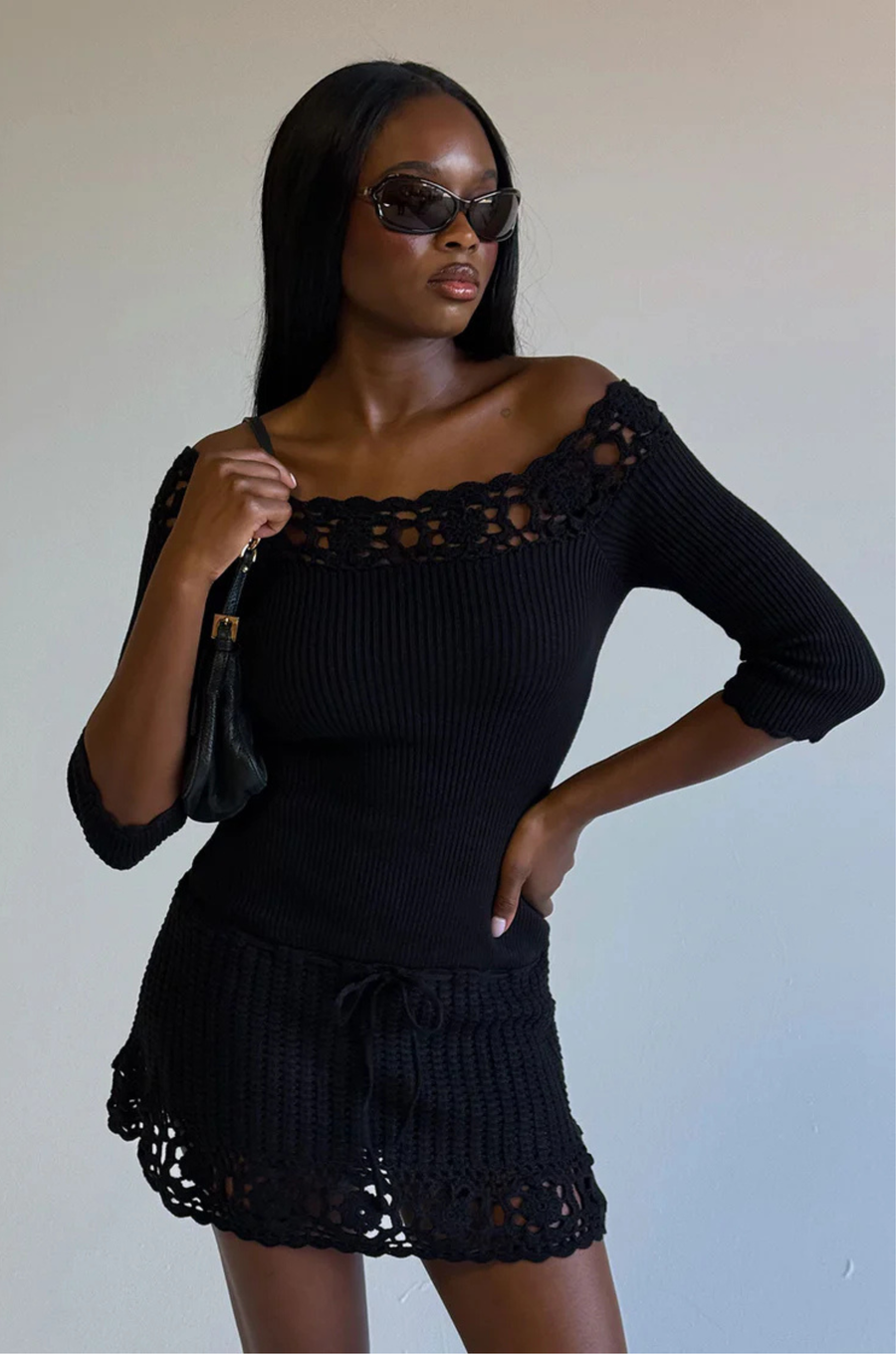 Knit crochet mini dress
Designed in Cloud Knit fabric
Drop waist dress
Soft crochet fabric on the neckline and skirt
Tie detail on the skirt
Crochet design on neckline and skirt
FRANKIES BLACK KNIT CROCHET MINI DRESS
3/4 SLEEVE