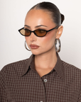 Small frame sunglasses
Black frame
Tan lens
Acrylic