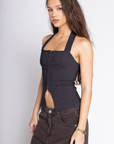 Blue Knit plaid halter tank top
Adjustable neck tie
Bottom hem V opening
Front hook and eye closures
Length: 14.5"
Polyester/Spandex/Rayon
Going out top