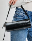 Barrel shoulder bag
Cylindrical silhouette shoulder bag
Versatile strap - over the shoulder or crossbody
Adjustable Shoulder Strap
Zip closure
Vegan Leather
black barrel bag
black barrel purse