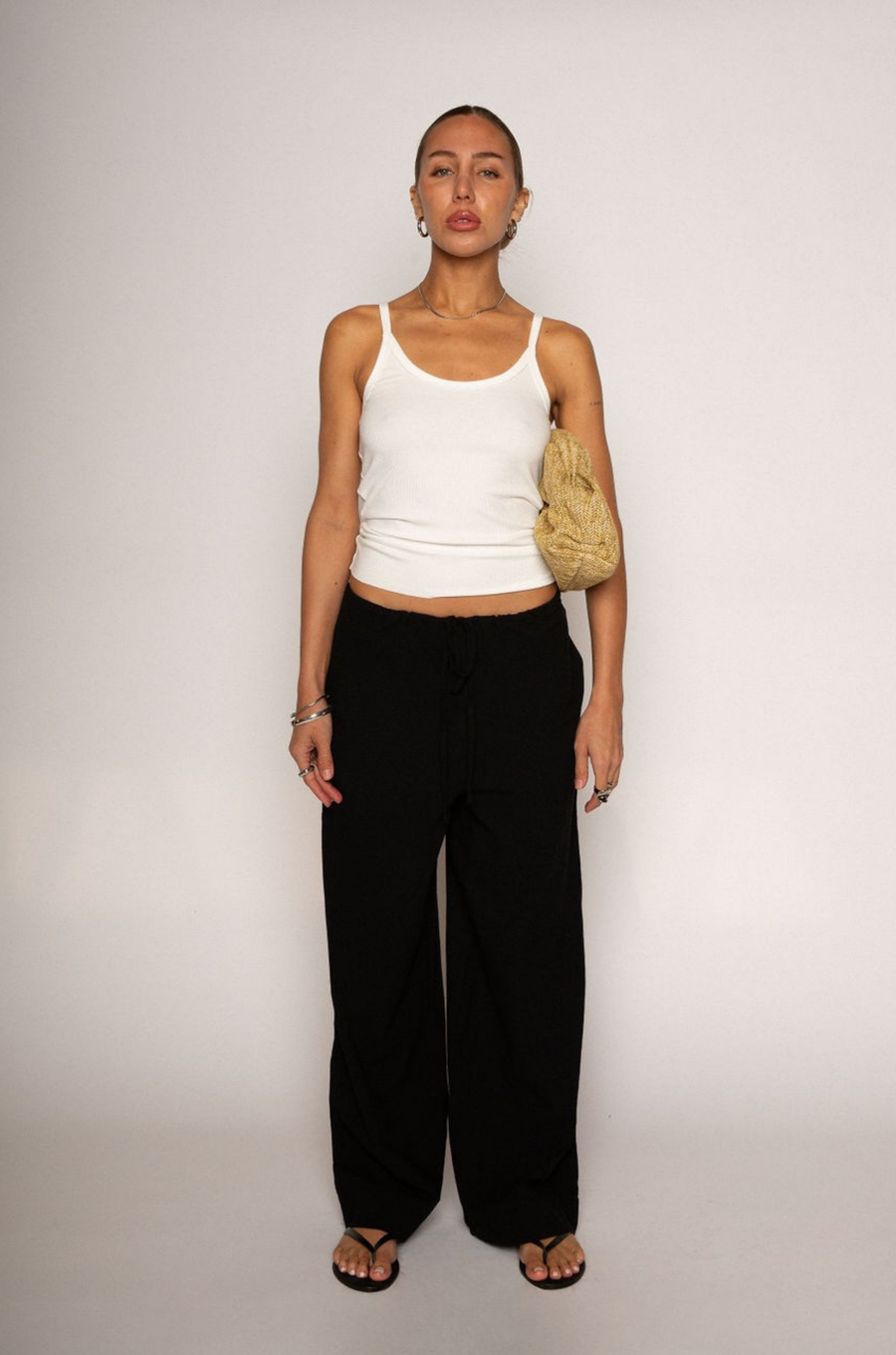 Woven pants
Elastic waist with drawstring closure
Side pockets
Unlined
black linen pants
resort lounge wear
summer pants
