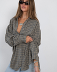 black and white Textured plaid button down shirt
Collard
Front pocket
Button down closure
Cotton/Polyester