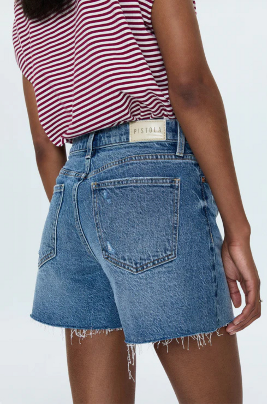Mid-rise denim short
Medium length
Relaxed fit
Medium blue denim wash
Whiskering and a frayed, distressed hem
