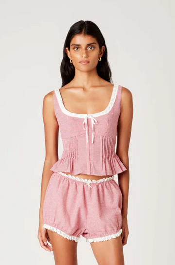 Gingham printed tank top
Figure-hugging bodice with peplum hem
Bodice pleating
Scoop neck with delicate trim &amp; bow detailing
Front hook eyelet closure
red and white gingham tank top
fourth of july top outfit