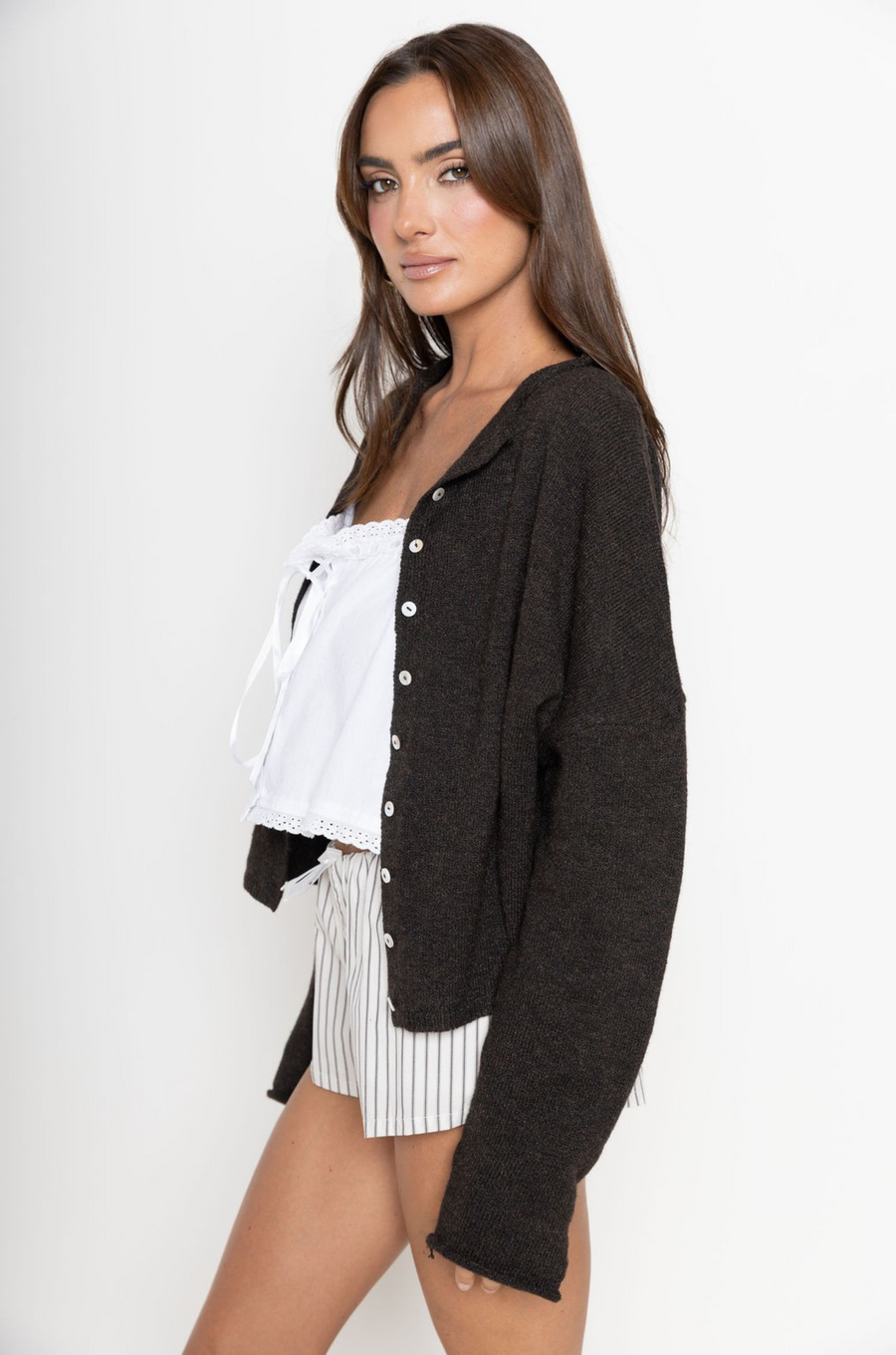 Fuzzy knit cardigan
Crewneck
Front button down closures
Long sleeves
Unlined
chocolate brown cardigan
fall cardigan
fall outfit
fall transition outfit