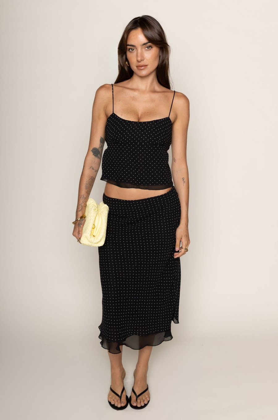 Chiffon polka dot midi skirt
Peek-a-boo under layer
Side zipper closure
Lined
black and white polka dot midi skirt