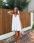 white Halter mini dress
Adjustable neck tie
Side pockets
Lined